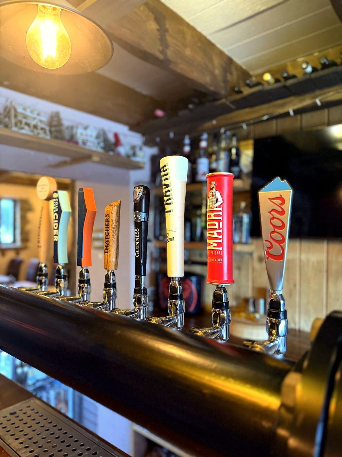 The beer taps at the restaurant bar, with Thatchers, Guinness, Madri and Coors